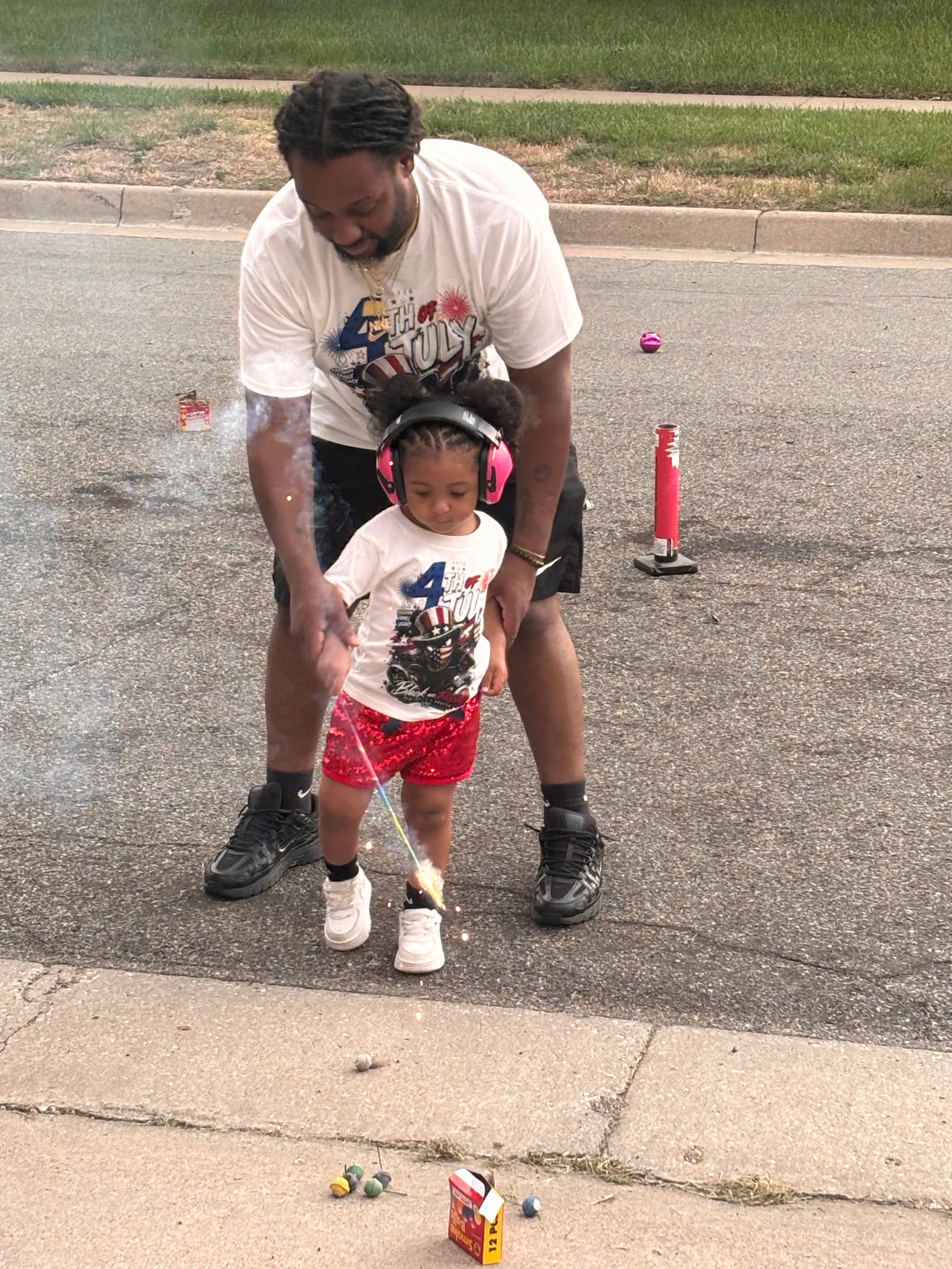 Dominique Beasley, co-owner of Little Dreamers Village with a child